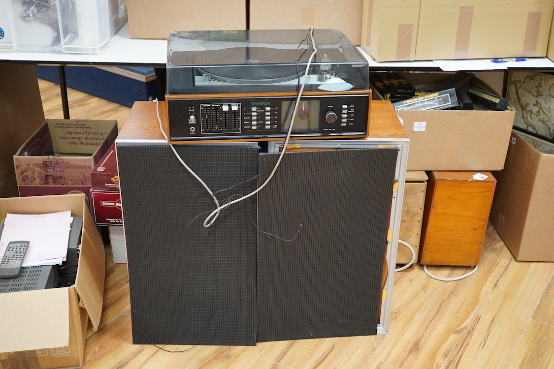 A Dynatron Goldring GL78 turntable with integral amplifier and tuner, made in Switzerland, together with a pair of Leak Sandwich 600 stereo speakers in teak cabinets, 65cm high